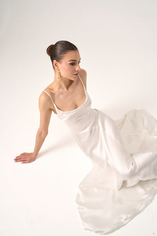 Refined wedding dress with a scoop neckline, bias-cut silk design, and luxurious slip silhouette