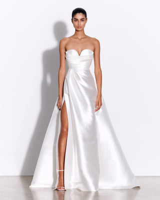 Model wearing the Harper wedding dress by Alex Perry in a full front view, showcasing the strapless design and luxurious fabric with a flattering silhouette.