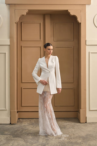 Sheath wedding dress with a structured jacket-style top, refined long sleeves, and soft lace skirt for effortless elegance.