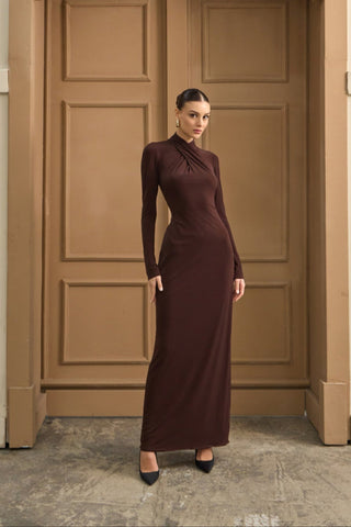 Elegant maxi dress featuring a refined crossed turtleneck and fluid jersey fabric for a graceful drape.