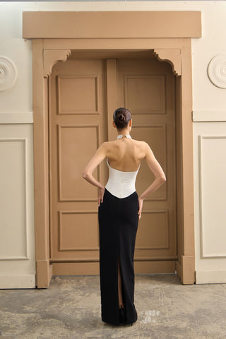 Sophisticated corset wedding dress with a sculpted neckline and flowing skirt, creating a romantic and refined silhouette.