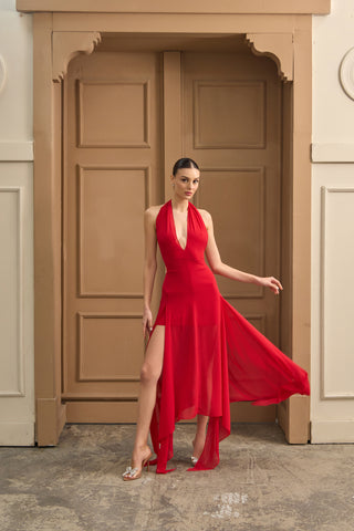 Flowing halter evening dress with a plunging neckline and structured bodice, designed for effortless elegance and movement.