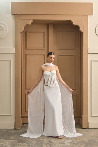 Sophisticated strapless wedding gown with a sculpted bodice, corset detailing, and a graceful floor-length skirt.