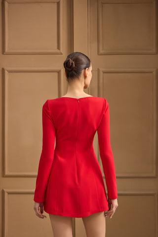 Elegant evening mini dress with a sleek fitted silhouette, long sleeves, and delicate bows for a timeless, sophisticated appeal.