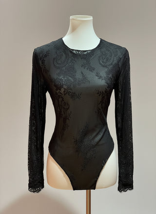 Black lace long-sleeve bodysuit on a mannequin against a neutral background