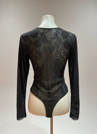 Black lace bodysuit on a mannequin against a neutral background