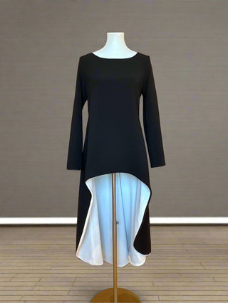 Black and white dress on a mannequin in a store setting
