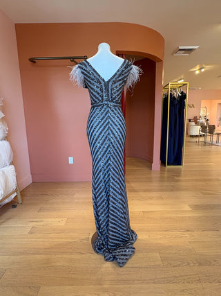 Denali gunmetal sequin gown with feather cap sleeve