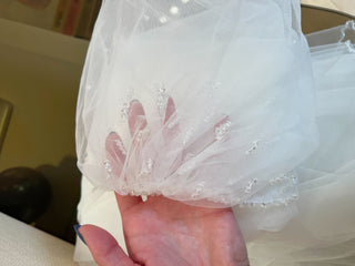 Floor-sweeping formal veil with refined beaded border and illusion tulle composition for luxury bridal styling