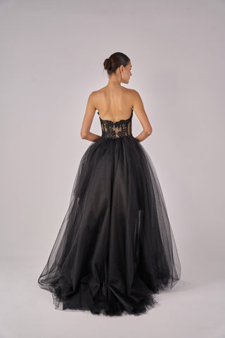 Black strapless gown with lace detailing on a plain background