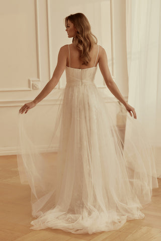 Mia Lavi designer wedding dress with delicately draped tulle bodice and soft lace layers for modern romantic elegance