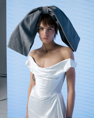 Vivienne Westwood made-to-order Comet gown with side-swept train, architectural silhouette, and heritage-inspired detailing