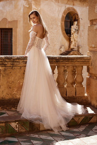 Mia Lavi bridal gown featuring signature lace artistry and a romantic corset bodice in couture design