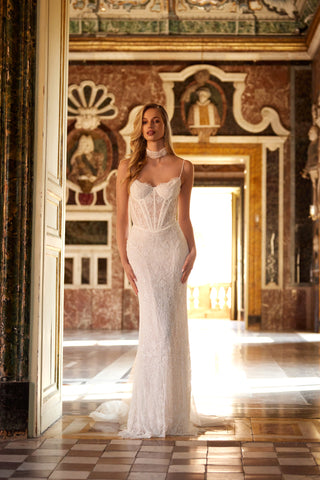 Mia Lavi couture wedding gown in hand-embroidered lace featuring a sheer corset bodice and intricate beaded detailing