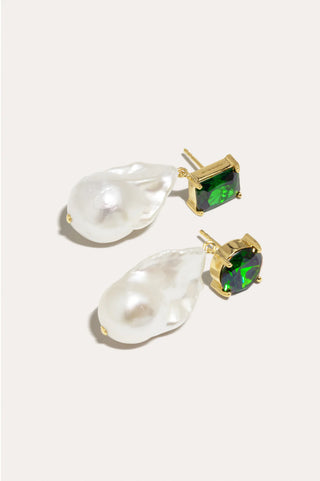 Elegant sculptural earrings with baroque pearls and radiant zirconia accents for a timeless statement.