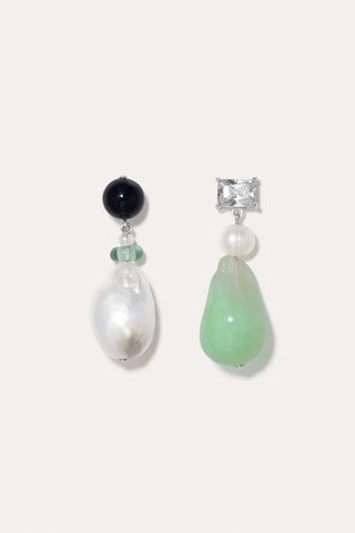 Sculptural earrings featuring asymmetrical design with baroque pearls and zirconia accents.