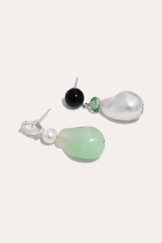 Timeless earrings showcasing sustainable materials, with sparkling zirconia and organic elements.
