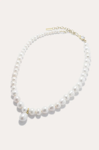 Statement pearl and zirconia necklace with adjustable vermeil chain, blending artisanal craftsmanship and modern elegance for special occasions.