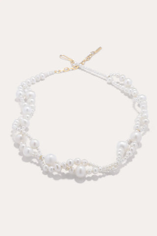 Graceful freshwater pearl necklace with a sculptural silhouette, showcasing a dynamic interplay of structure and movement for a refined look.