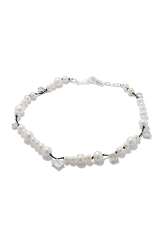 Elegant designer necklace featuring an organic arrangement of luminous pearls and CZ, crafted with Completedworks’ signature sculptural aesthetic.