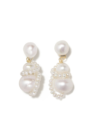 Sculptural drop earrings featuring cascading freshwater pearls wrapped in delicate strands, embodying modern elegance and artisanal craftsmanship.