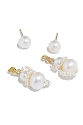 Handcrafted statement earrings with an organic silhouette, showcasing fluid pearl arrangements and Completedworks’ signature sculptural aesthetic.
