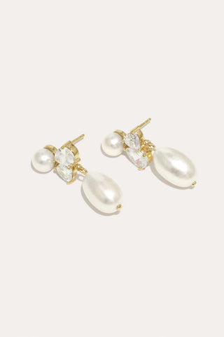 Timeless statement earrings with a graceful balance of pearls and zirconia, showcasing luxury craftsmanship.