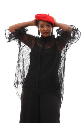 Lace blouse with Mandarin neckline, sheer detailing, and ruffled 3/4 sleeves