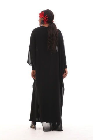 Maxi-length formal gown with a flowing design, refined embellishments, and cape-style sleeves for a luxurious statement look