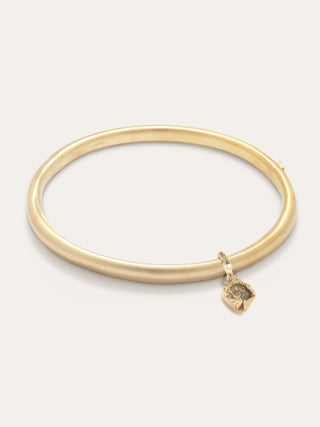 Sculptural designer necklace with a fluid, curved band and crumpled charm detail, embodying modern elegance and artisanal craftsmanship.