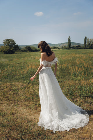 Daalarna bespoke bridal creation highlighting couture corsetry, hand-embroidered floral sleeves, and luxury detailing