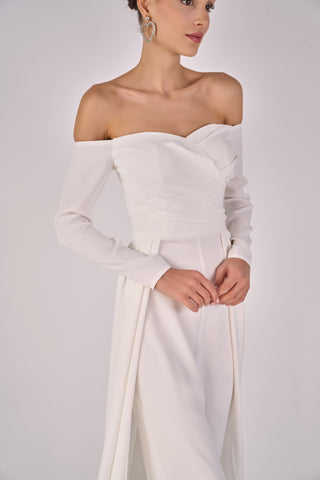 White off-shoulder jumpsuit with long sleeves on a plain background
