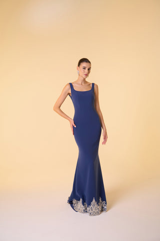 Mermaid evening dress crafted from crepe fabric, with a scoop neckline and detailed embellishments for a timeless look.