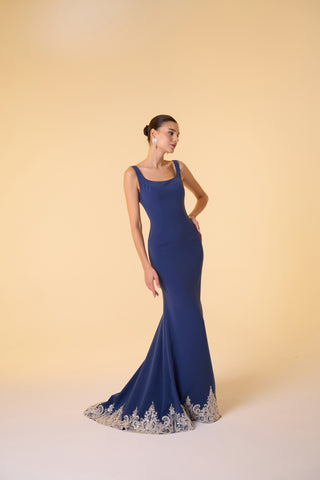 Maxi formal gown featuring a scoop neckline, sleeveless fit, and intricate embellishments adding a touch of glamour.