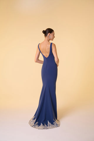 Luxurious crepe evening dress showcasing a sleek silhouette, refined scoop neck, and glamorous embellished details.