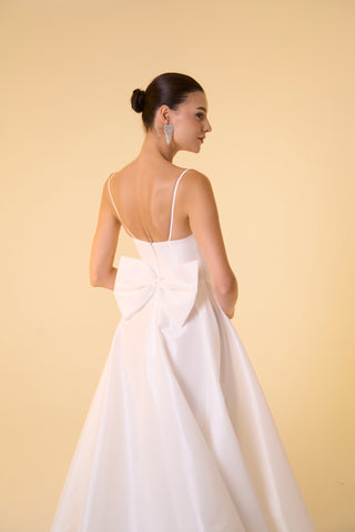 Bridal taffeta dress with tailored bodice, full skirt, and evening-ready design elements for luxury styling