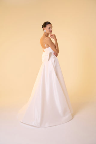 Formal dress featuring a fitted bodice and full-length taffeta skirt for graceful movement