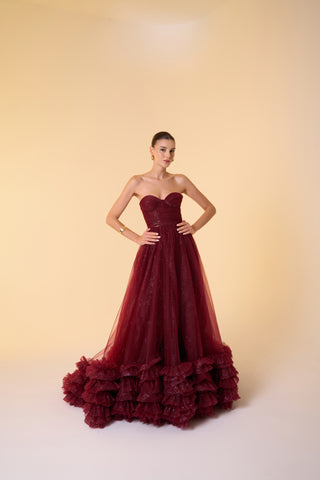 Sparkling tulle ball gown with strapless sweetheart neckline and dramatic ruffled hem for an elegant evening look