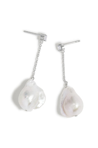 Elegant statement earrings with handcrafted silver chains, natural baroque pearls, and a refined zirconia stud for a contemporary luxury look.