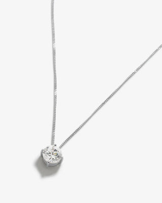 Minimalist pendant necklace featuring a fine recycled silver chain and a radiant cubic zirconia solitaire in a classic prong setting