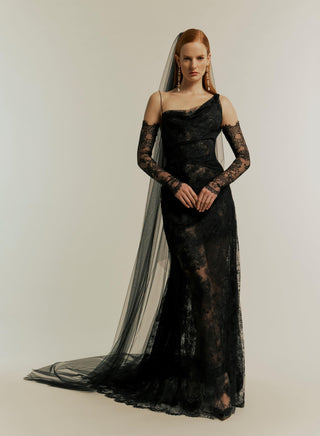 Full body view of the Lace Minerva gown in black, displayed against a plain white backdrop, emphasizing its elegant shape and eco lace.