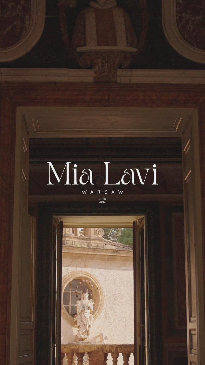 Mia Lavi designer wedding gown featuring delicate sparkle, sheer corset structure, and timeless couture artistry