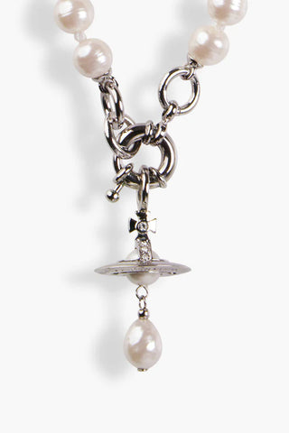 Close-up of the crystal-embellished orb on the Aleksa bracelet by Vivienne Westwood, featuring a single pearl at the center.